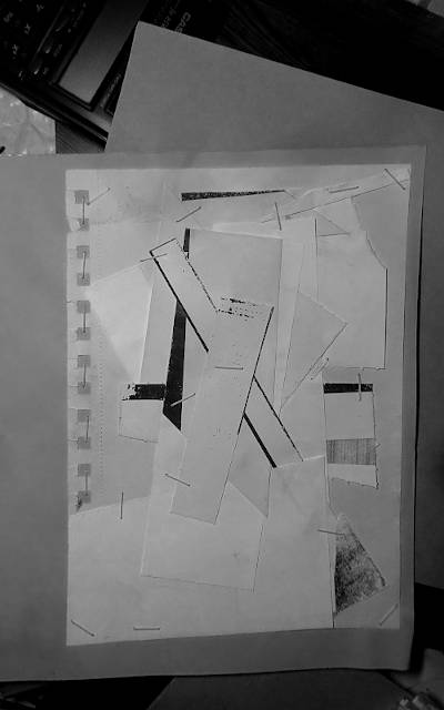 black and white photograph of a paper collage. random cut pieces of papers with no special print on them are fixated with metal staples on another piece of paper beneath. it’s pretty random…