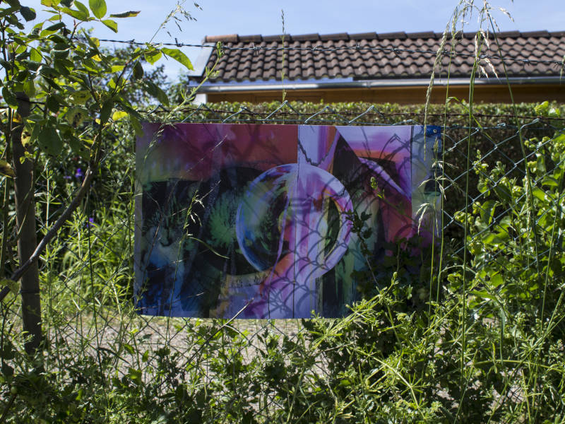 digital collage with glitched lost cats from the neighborhood, printed on pvc canvas, attached to a garden fence.