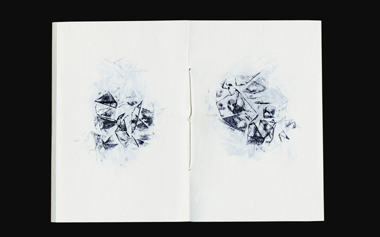 open book, black stamping of crumpled paper