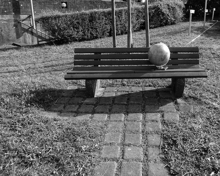 lost globe on a public bench