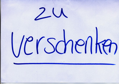 piece of paper with handwritten words “Zu Verschenken” (Give Away)